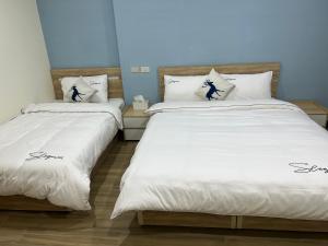 Postel nebo postele na pokoji v ubytování Downtown Accommodation