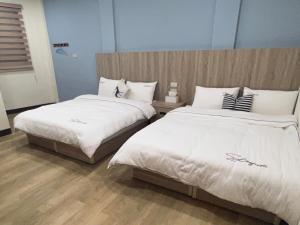Postel nebo postele na pokoji v ubytování Downtown Accommodation + 5 fotografií