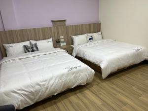 Postel nebo postele na pokoji v ubytování Downtown Accommodation