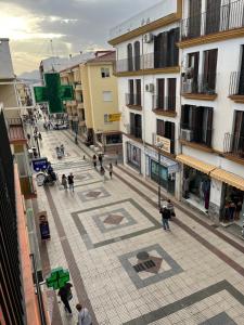 a group of people walking around a city street at APARTAMENTO 128 ESPINEL in Ronda