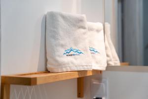 a towel sitting on a shelf in a bathroom at Apart Invest Żeromskiego 15/8 in Szklarska Poręba