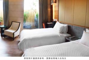 Postel nebo postele na pokoji v ubytování Royal Group Hotel Chun Shan Branch