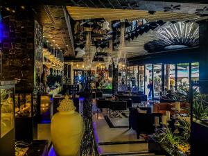 a restaurant with a large yellow vase in the middle at Hotel Marinela Sofia in Sofia