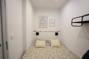 Łóżko lub łóżka w pokoju w obiekcie Rêve blanc 2 étoiles à Annecy centre ville et lac