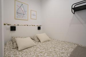 Łóżko lub łóżka w pokoju w obiekcie Rêve blanc 2 étoiles à Annecy centre ville et lac