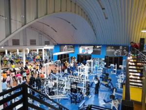 a crowd of people in a large room with machines at Hotel Ruinas Resort in Huehuetenango