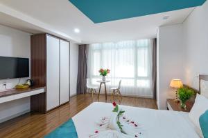 Voodi või voodid majutusasutuse Rich Hotel toas