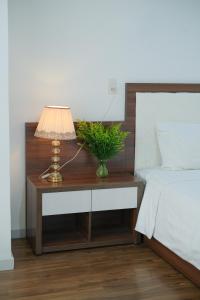 Voodi või voodid majutusasutuse Rich Hotel toas