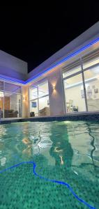 a large swimming pool with a large swimming pool at Santorini Breeze Chalet in Amman