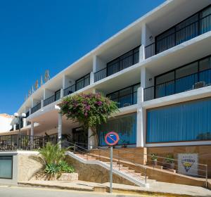a large building with a view of the ocean at Hotel Osiris Ibiza in San Antonio