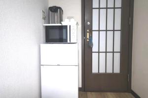 A kitchen or kitchenette at Kiki HouseH --Self Check-in -- Room Number & Password is in the following email