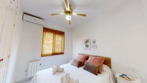 Katil atau katil-katil dalam bilik di Apartamento Jazmín +12 gambar