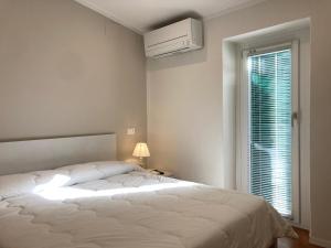 Ένα ή περισσότερα κρεβάτια σε δωμάτιο στο la suite di via Mazzini