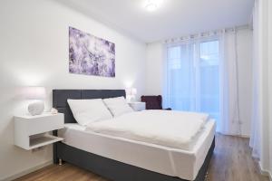 Postel nebo postele na pokoji v ubytování ApartWehr Business&Ferien Apartment Lila