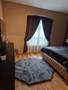 A bed or beds in a room at Апартамент RESORT SENSATION 3 Még 37 kép