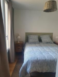 Posteľ alebo postele v izbe v ubytovaní Appartement terrasse centre Nyons