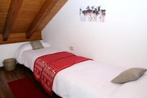 A bed or beds in a room at Apartaments Lo Paller