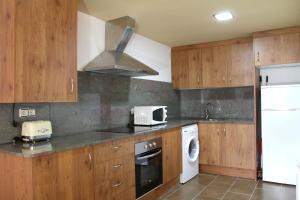 A kitchen or kitchenette at Apartaments Lo Paller