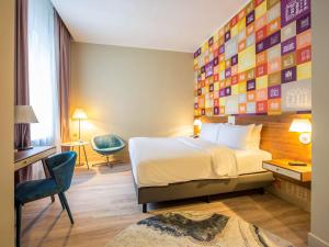 Postel nebo postele na pokoji v ubytování Mercure Riga Centre