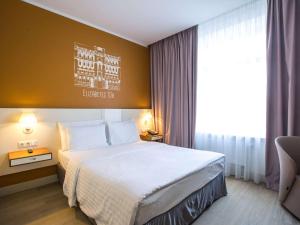 Postel nebo postele na pokoji v ubytování Mercure Riga Centre
