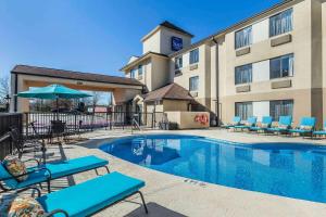 a hotel with a swimming pool in front of a building at Sleep Inn Gaffney at I-85 in Gaffney