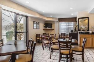 a dining room with tables and chairs in a restaurant at Sleep Inn Gaffney at I-85 in Gaffney