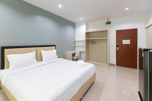 Postel nebo postele na pokoji v ubytování Green Hotel Phuket