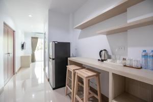 Kuchyň nebo kuchyňský kout v ubytování Green Hotel Phuket