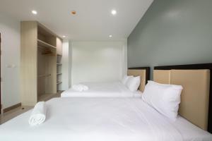 Postel nebo postele na pokoji v ubytování Green Hotel Phuket
