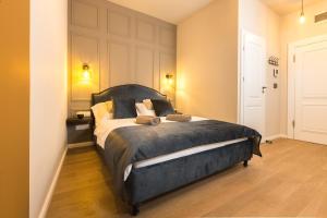 Posteľ alebo postele v izbe v ubytovaní Apáca 30 Apartman **** Győr