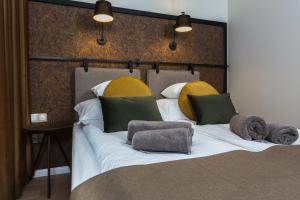 Posteľ alebo postele v izbe v ubytovaní Apáca 30 Apartman **** Győr