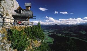 a building on the side of a mountain at Ferienhaus Walcher in Sankt Martin am Grimming