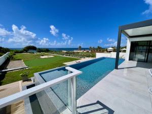 a view of a swimming pool from a house at Luxury Villa Beach and Putt avec accès plage in Saint-François