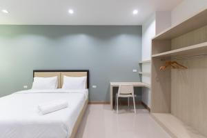 Postel nebo postele na pokoji v ubytování Green Hotel Phuket