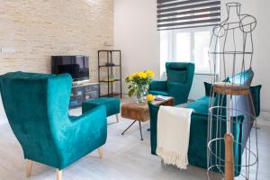 Televízia a/alebo spoločenská miestnosť v ubytovaní Apartament z historią, Klahra MyWeek