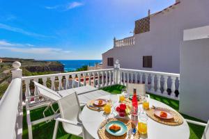 a table on a balcony with a view of the ocean at Sea sand and sun in Callao Salvaje