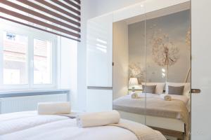 Posteľ alebo postele v izbe v ubytovaní Apartament z historią, Klahra MyWeek