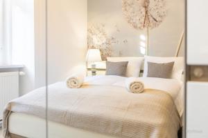 Posteľ alebo postele v izbe v ubytovaní Apartament z historią, Klahra MyWeek
