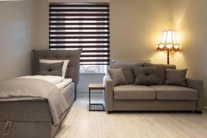 Posteľ alebo postele v izbe v ubytovaní Apartament z historią, Klahra MyWeek