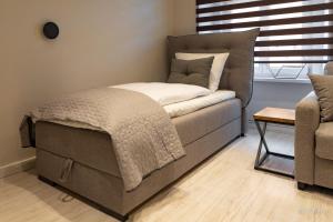 Posteľ alebo postele v izbe v ubytovaní Apartament z historią, Klahra MyWeek