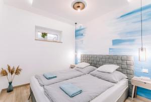 Posteľ alebo postele v izbe v ubytovaní Nádas Center Home Badacsony