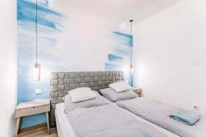 Posteľ alebo postele v izbe v ubytovaní Nádas Center Home Badacsony