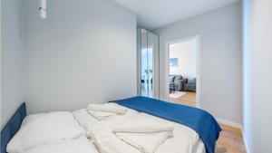 Łóżko lub łóżka w pokoju w obiekcie Apartamenty Sun & Snow BLUE II