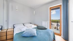 Łóżko lub łóżka w pokoju w obiekcie Apartamenty Sun & Snow BLUE II