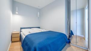 Łóżko lub łóżka w pokoju w obiekcie Apartamenty Sun & Snow BLUE II