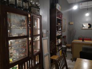 a living room with a table and a window at REQUELstore in Sungai Pelik