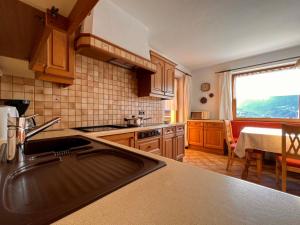 a kitchen with a sink and a counter top at Haus Barbara in Zell am Ziller
