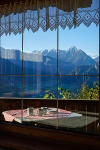 a window with a table and a view of mountains at Haus Barbara in Zell am Ziller