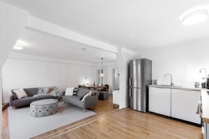 a living room with a couch and a kitchen at Beautiful 3 Room apartment in Kreuzberg in Berlin