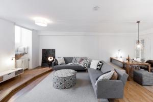 a living room with a couch and a table at Beautiful 3 Room apartment in Kreuzberg in Berlin